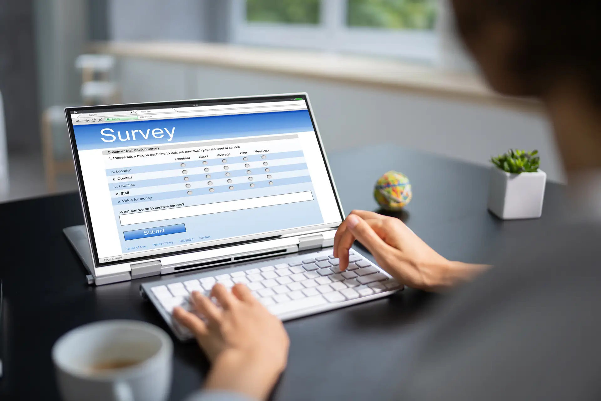 Woman Looking At Online Computer Survey Or Feedback