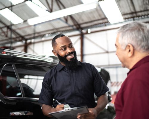 Car mechanics, workers, customers, satisfaction / Auto car repair service center.