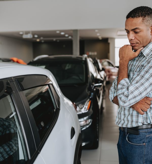 Man analyzing car to buy
