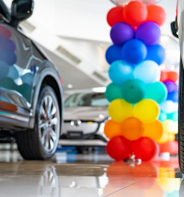 Car parked in luxury showroom. Car dealership office. Car showroom business. New car parked in modern showroom. Auto for sale and rent business. Automobile leasing and insurance. Electric automobile.
