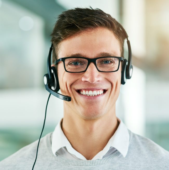 Portrait of a young call center agent working in an office